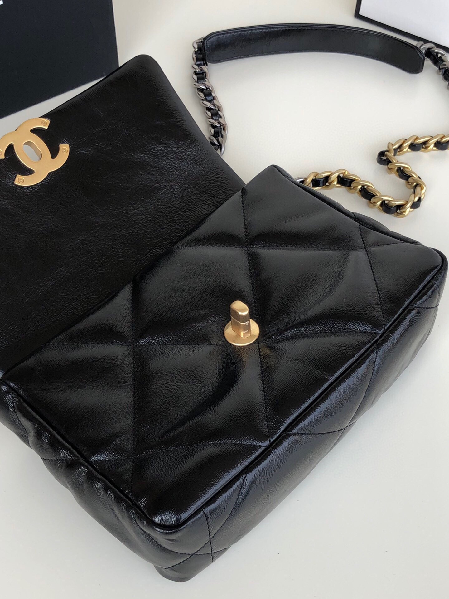 Ch**el 19 HANDBAG Shiny Leather, Gold-Tone, Silver-Tone & Ruthenium-Finish Metal Black 6.2 × 10.1 × 3.5 in