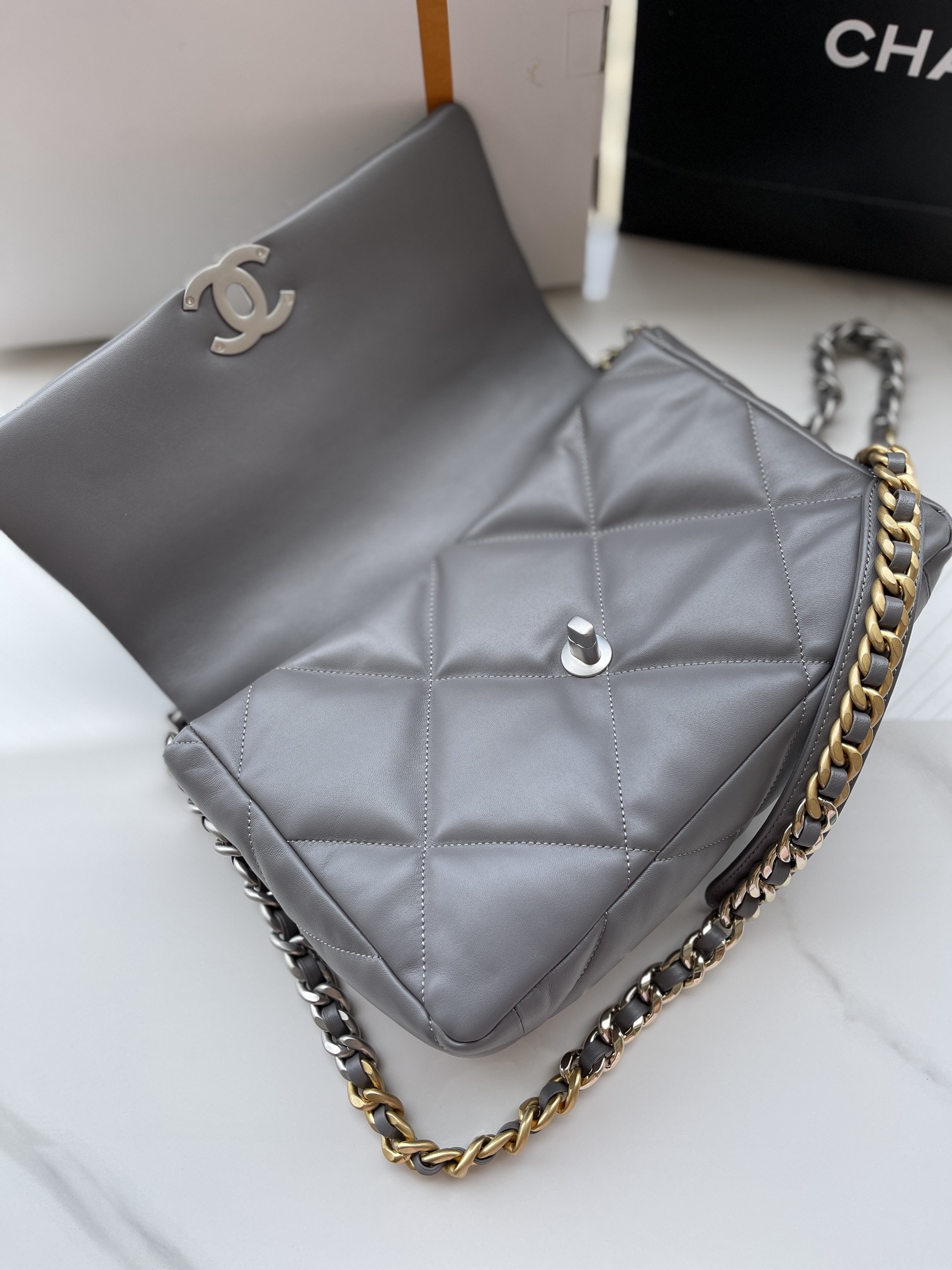 Ch**el 19 LARGE HANDBAG Shiny Leather, Gold-Tone, Silver-Tone & Ruthenium-Finish Metal Gray 7.8 × 11.7 × 3.9 in