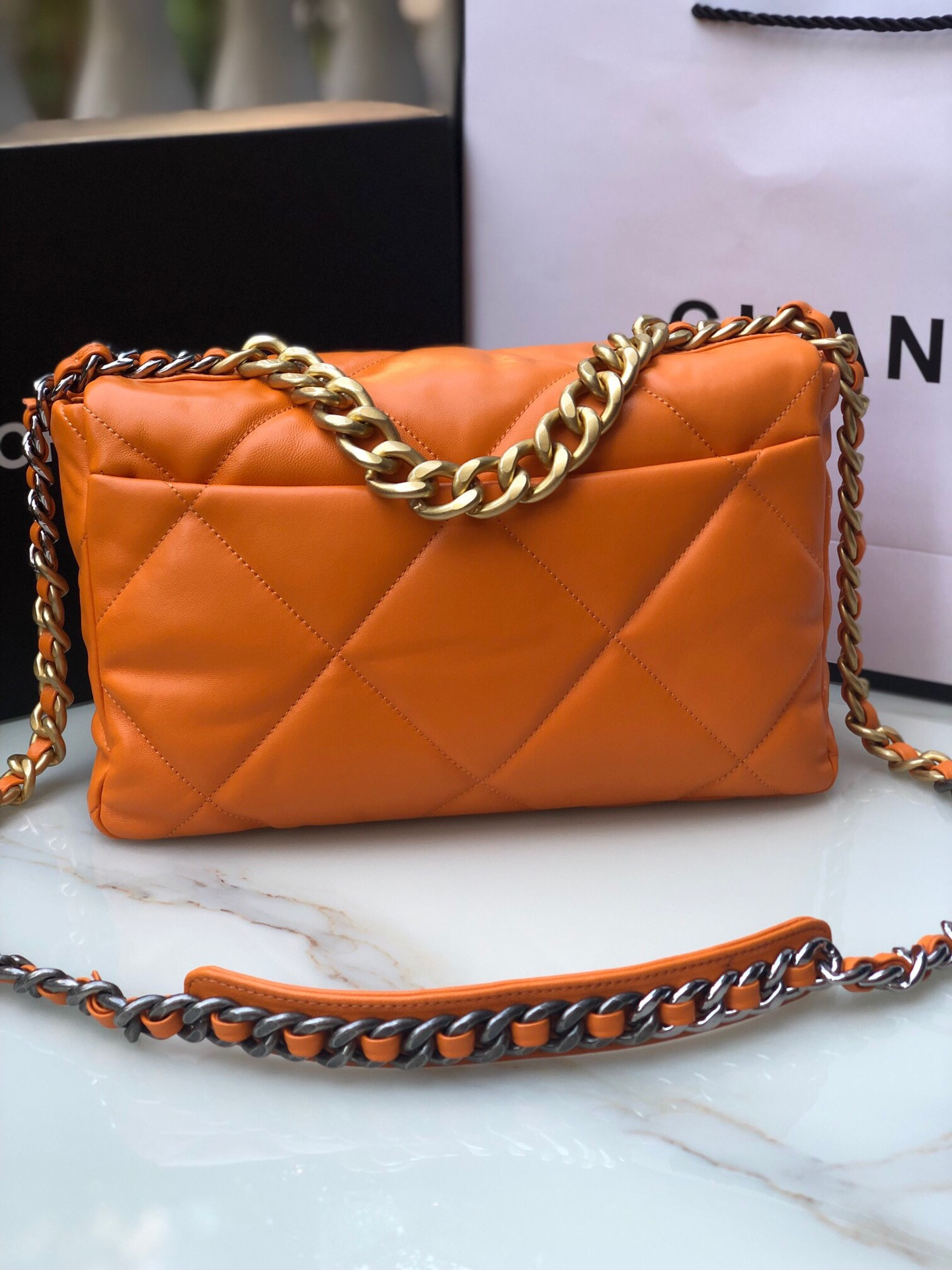 Ch**el 19 LARGE HANDBAG Shiny Leather, Gold-Tone, Silver-Tone & Ruthenium-Finish Metal Orange 7.8 × 11.7 × 3.9 in